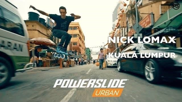 Nick Lomax en roller à travers les rues de Kuala Lumpur